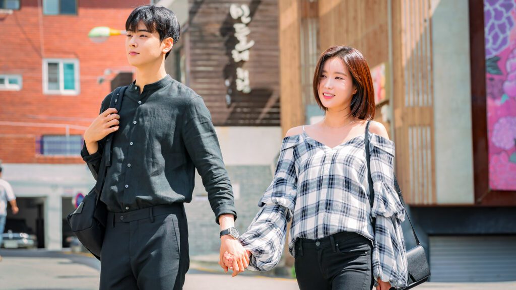 Main couple walking together and holding hands in the Korean drama My ID Is Gangnam Beauty
